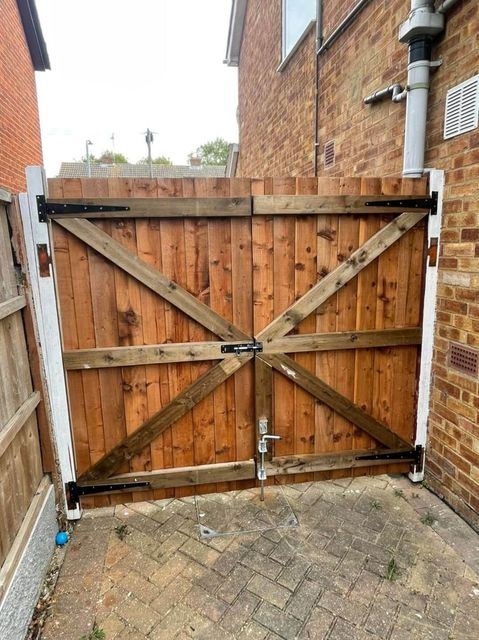 Diagonally braced timber gate hung on galvanised hinges