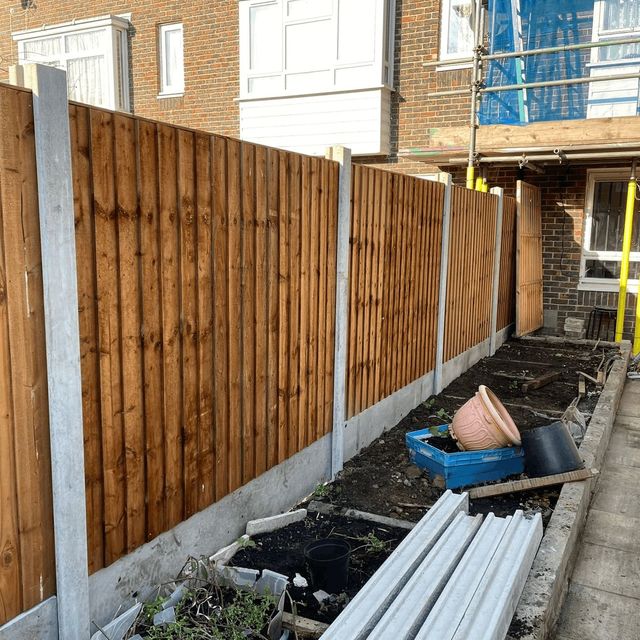 Closeboard fencing built on concrete posts with gravel boards